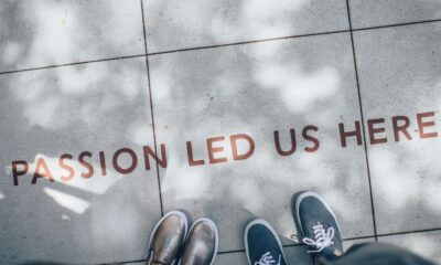 two person standing on gray tile paving